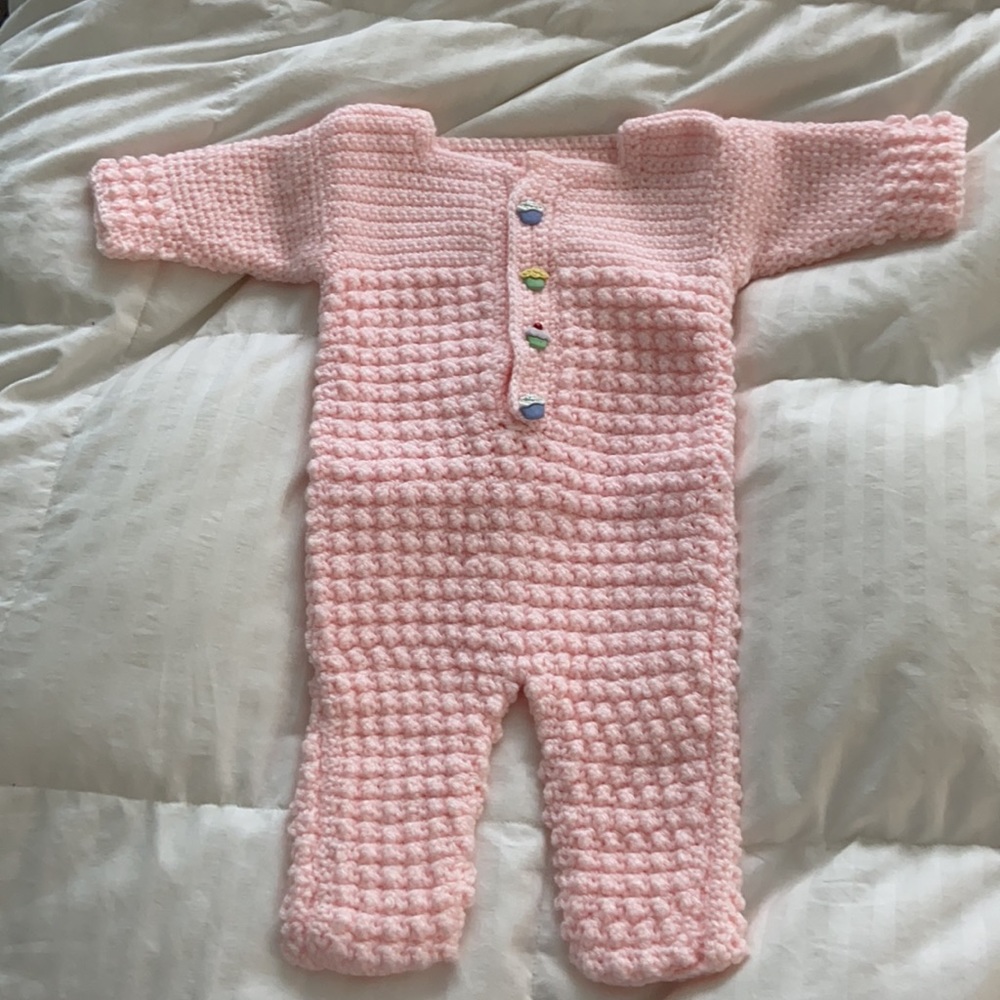 Custom crochet newborn onesie, light pink with cupcake buttons